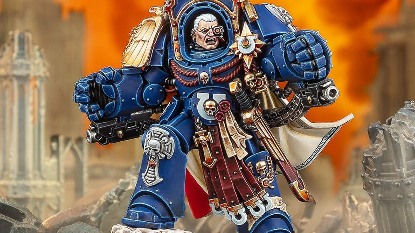 Close-up view of Marneus Calgar in ornate Ultramarines armor holding a power sword